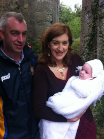 Seán Óg Patrick Cleary with his parents Lorraine and Michael on his baptism day on Canons' Island.