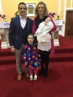 Luke Daniel O’Grady on his baptism day with his parents Éimear and Noel and his sister Leah.