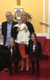 Ella Doohan with her parents and sisters on her baptism day.